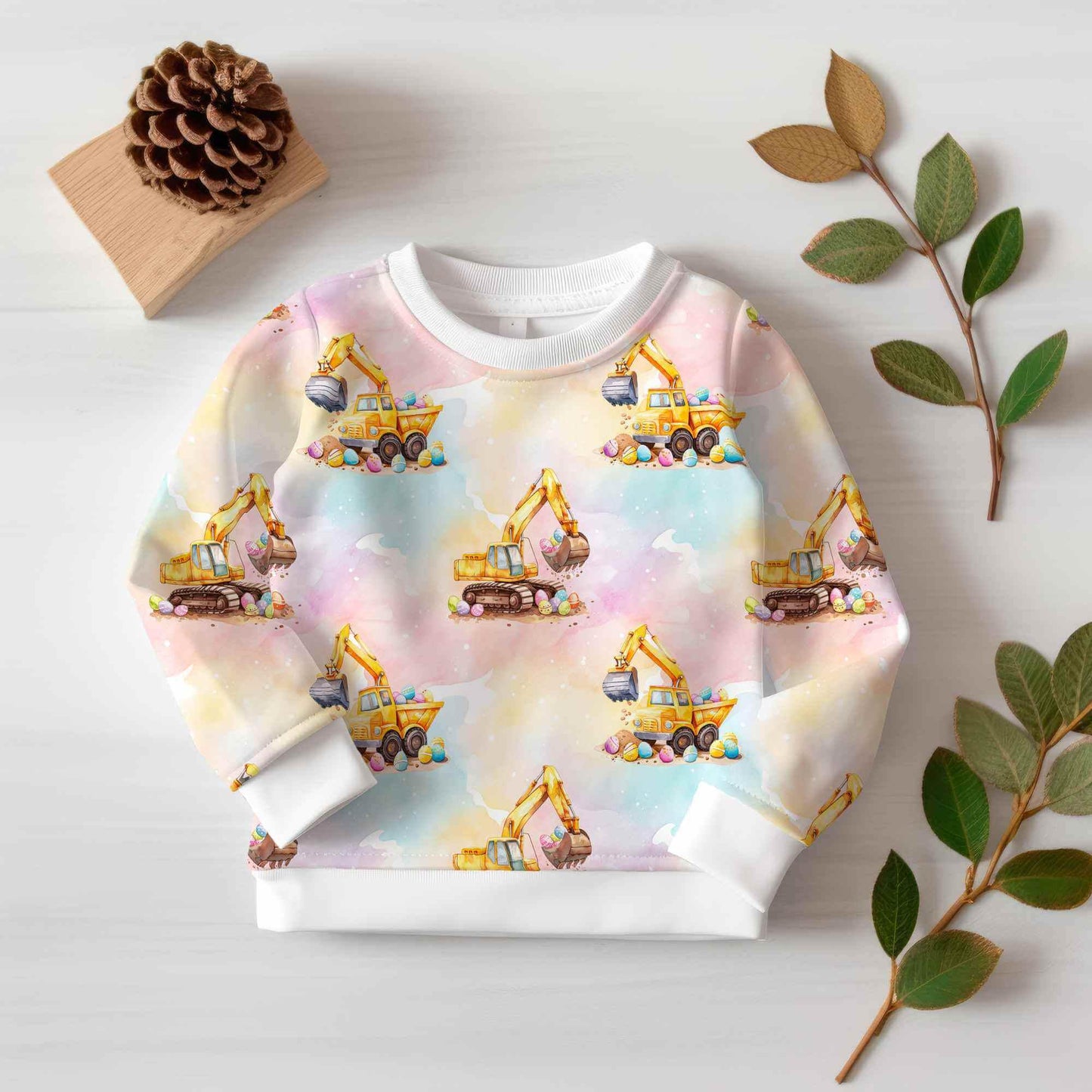 Nähbeispiel: Gemütlicher Sweatshirt für Kinder aus weichem Jersey oder French Terry mit verspieltem Bagger und bunten Ostereier.