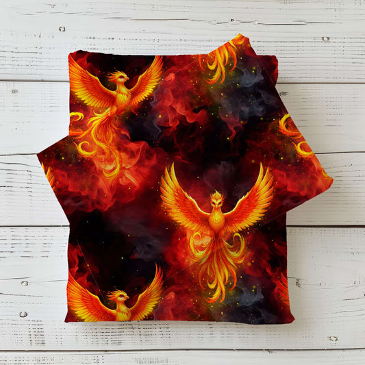 Dunkler Phönix Stoff mit leuchtendem Feuervogel und Flammenmotiv – hochwertiger Jersey und French Terry als Meterware für besondere Nähprojekte